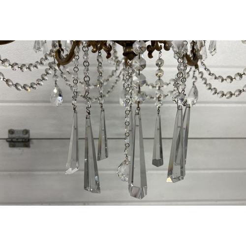 1272 - A vintage 8 arm brass and crystal chandelier ceiling pendant, with electrical wiring. Crystal drops ... 