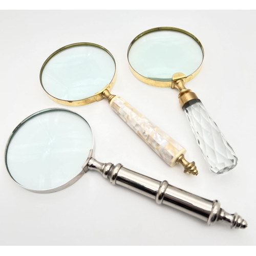 1273 - 3 large magnifying glasses to include faceted glass handled, handle set with pearl panels and silver... 