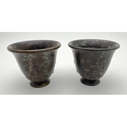 1210 - A pair of small Chinese bronze footed incense pots with embossed detail to outer bowl. Impressed sig... 