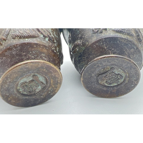 1210 - A pair of small Chinese bronze footed incense pots with embossed detail to outer bowl. Impressed sig... 