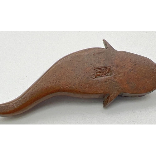 1275 - A signed miniature Japanese bronze, modelled as a catfish. Impressed signature to underside. Approx.... 