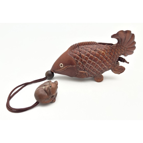 1211 - A carved wooden Oriental inro modelled as a catfish with carved mouse shaped pendant. With bone set ... 