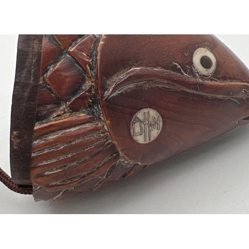 1211 - A carved wooden Oriental inro modelled as a catfish with carved mouse shaped pendant. With bone set ... 