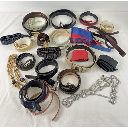 1334 - A collection of vintage belts in varying style and sizes. To include leather, cotton and chain. Desi... 