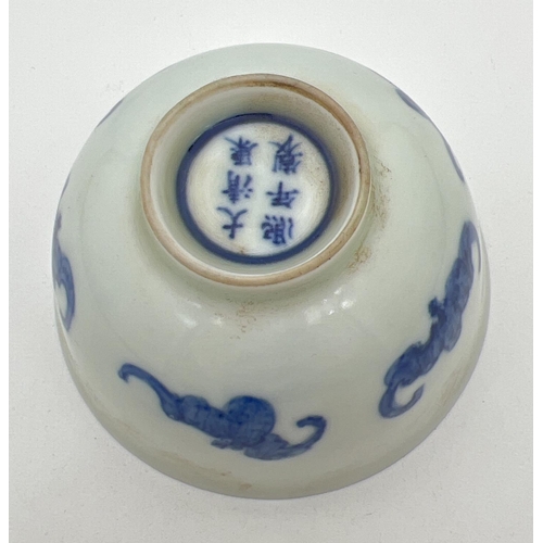 1213 - A small Chinese porcelain tea bowl with hand painted blue fu bat design to outer bowl. Blue ring and... 