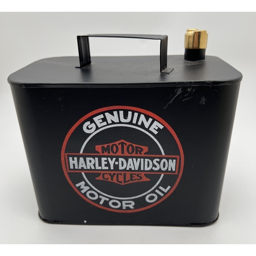 1245 - A small metal Harley Davidson oil can, painted black with brass screw top. Approx. 19cm tall.