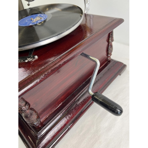 1241 - A reproduction wooden cased table top, wind up, trumpet gramophone marked 