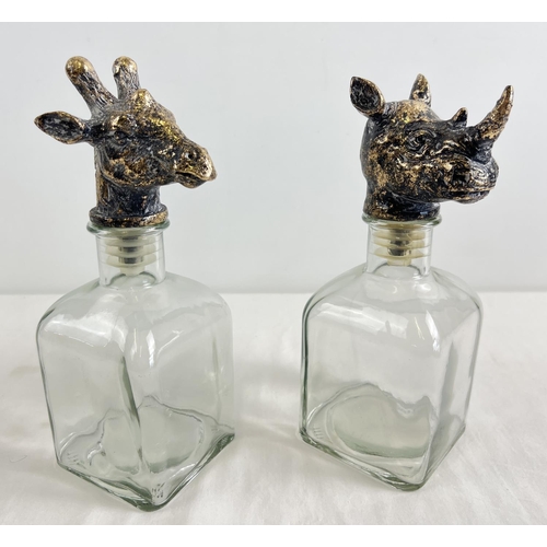 1276 - 2 modern square shaped decanters with stoppers modelled as animal heads - a rhino and a giraffe. Eac... 