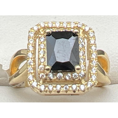 1033 - A new with tags 14kt gold plated cocktail ring set with Swarovski crystals. Square cut black stone s... 