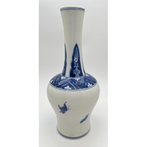 1215 - A Chinese blue & white slim necked vase with hand painted figural detail and wide rim with cherry bl... 