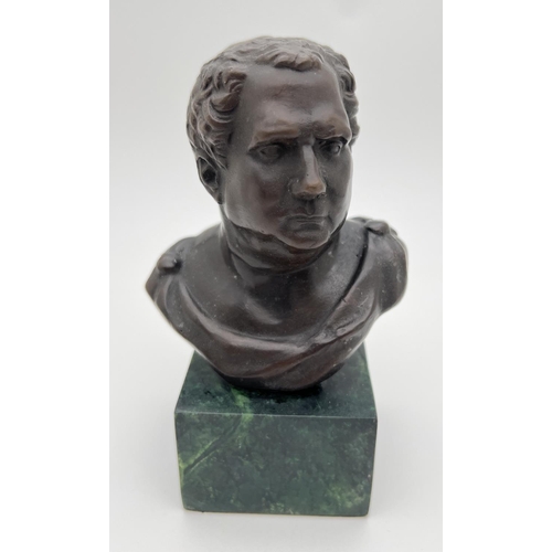 1144 - A small bronze bust mounted on a square shaped green marble base. Approx. 14cm tall.