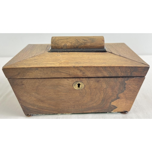 1231 - An antique sarcophagus shaped wooden tea caddy with bun feet and brass escutcheon. 2 interior lidded... 