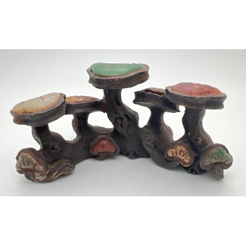 1220 - A Chinese bronze Scholars rock modelled as a cluster of mushrooms, set with natural stone panels. Ap... 