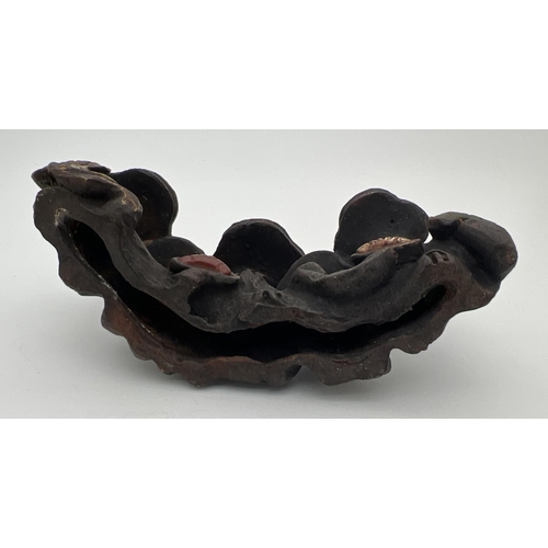 1220 - A Chinese bronze Scholars rock modelled as a cluster of mushrooms, set with natural stone panels. Ap... 