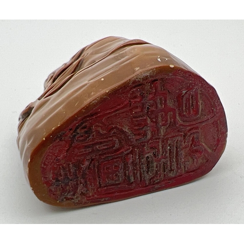 1222 - A small Chinese soapstone seal modelled as rocks with carved foliate detail. Approx. 5.75cm tall.