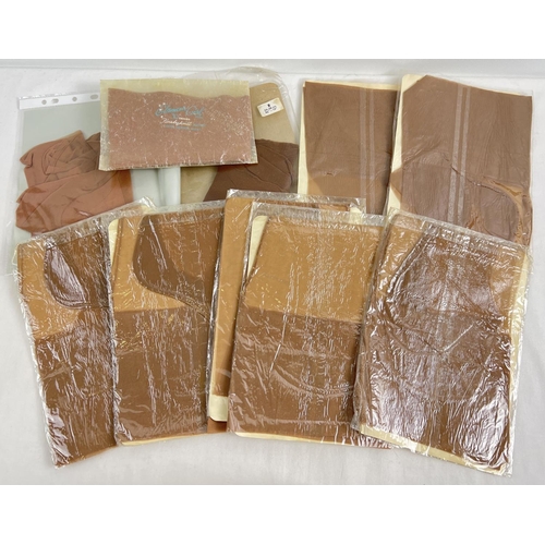 1344 - 10 assorted vintage pairs of seam free nylon stockings in clear plastic packaging. To include Glamou... 