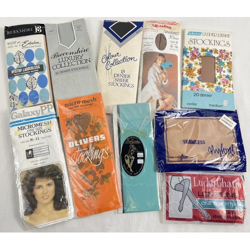 1345 - 10 assorted vintage pairs of seam free nylon stockings in various colours, in original packaging. To... 