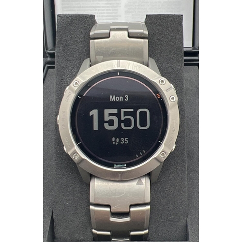 1106 - A boxed Garmin Fenix 6X Pro Solar Multisport GPS wristwatch with gunmetal grey titanium strap. With ... 