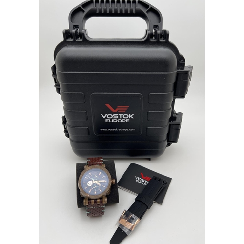 1108 - A boxed Vostok Europe Energia Rocket 0157/3000 chronograph automatic wristwatch. Black face with ros... 