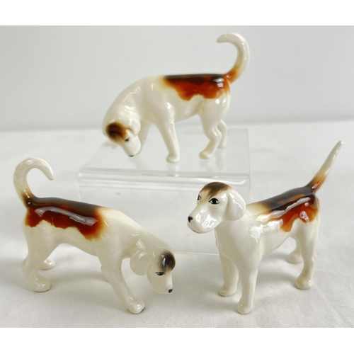 1169 - 3 Beswick ceramic fox hounds, in gloss finish with oval back stamps.