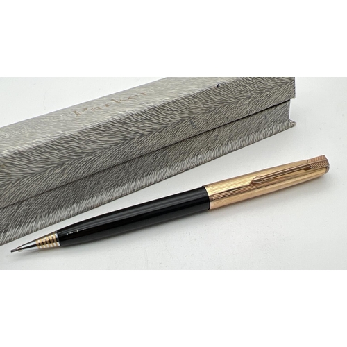 1135 - A vintage Parker 51 fountain pen together with a Parker mechanical pencil. Both with black Case and ... 