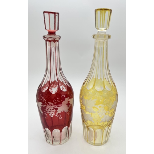 1193 - 2 late Victorian bohemian glass decanters with etched grape & vine detail. With cranberry and amber ... 