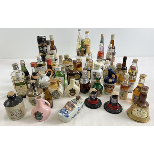 1280 - A collection of 49 assorted vintage alcohol miniatures to include novelty examples. Lot includes whi... 