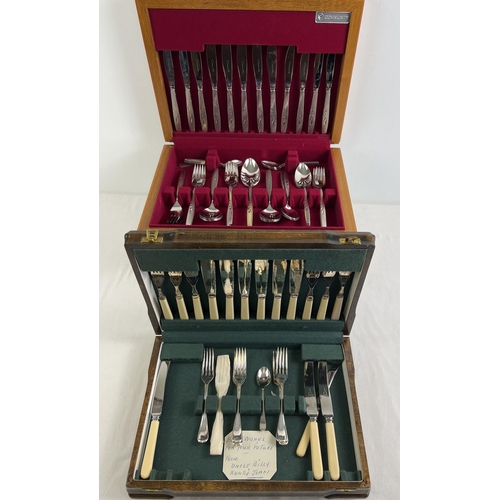 1146 - 2 vintage wooden cased cutlery canteens. A 1940's part canteen with complete fish set, together with... 