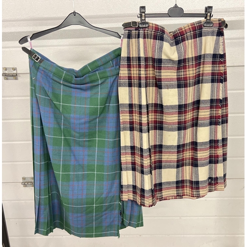 1347 - 2 vintage Scottish pure wool tartan kilts. A cream, maroon and blue kilt with leather and buckle fas... 