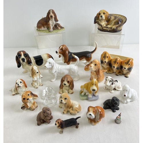 1177 - A collection of ceramic, resin & glass bassett hound dog figures, to include large Beswick bassett h... 