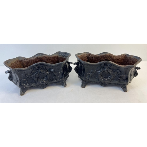 1148 - A pair of antique cast iron footed planters, painted black with floral & swag detail. Each approx. 1... 