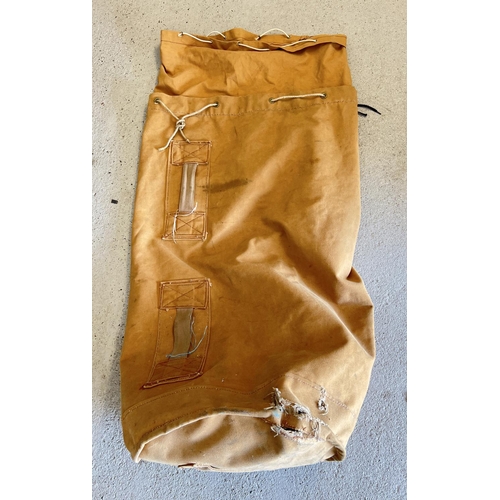 1296 - A large orange/brown canvas Seaman's kit bag with rope drawstrings. Stamped inside and dated 1980. W... 