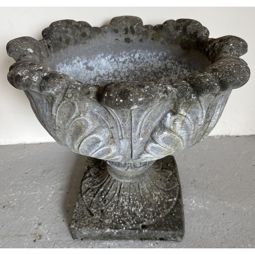 A large 2 sectional pedestal garden planter of classical form with scrolled foliate design and square shaped base. Approx. 44cm tall x 49cm diameter.