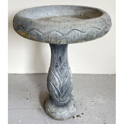 1476 - A large modern concrete garden bird bath with floral design to base. 2 sectional, approx. 60cm tall ... 