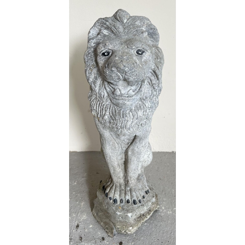 1477 - A large concrete garden ornament modelled as a lion. Approx. 55cm tall.