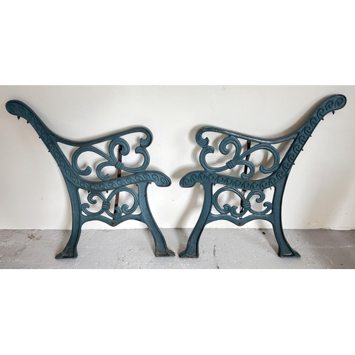 1497 - A pair of cast iron bench ends with scroll design, painted green. Approx. 78cm tall x 70cm wide.