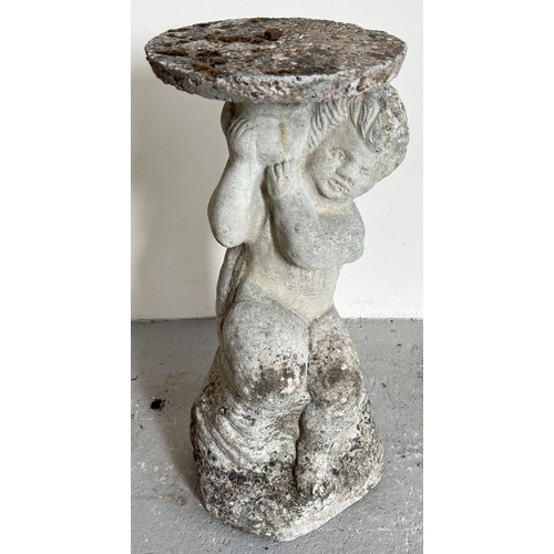 1506 - A vintage concrete garden pedestal modelled as a cherub holding an urn. With concrete circular platf... 