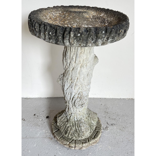 1507 - A large vintage weathered concrete bird bath in the form of a tree trunk with shallow bath. 2 sectio... 