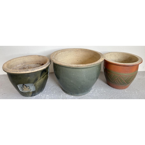 1510 - 3 glazed stoneware garden planters of varying sizes. A large green/blue gazed pot (approx. 27cm tall... 