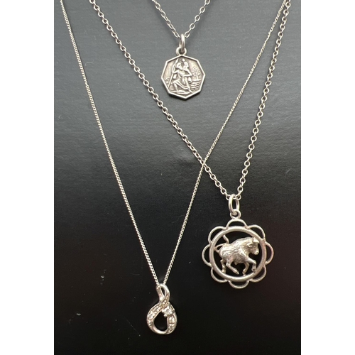 1062 - 3 silver pendant necklaces. A cubic zirconia set infinity loop on a 19