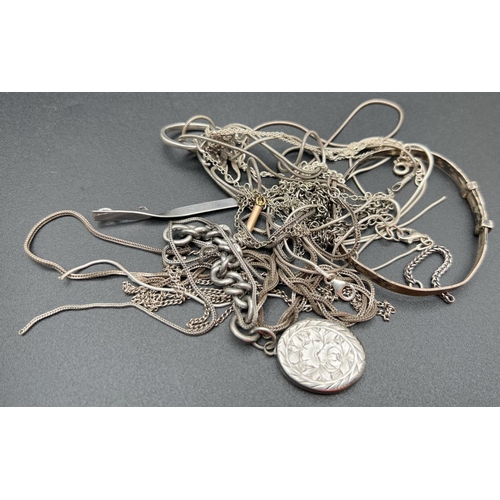 1066 - A quantity of assorted scrap silver jewellery items and broken chains. Total weight approx. 50.4g.