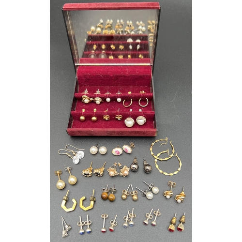 71 - A small earring jewellery box with interior mirror containing 25 pairs of stud, hoop and drop costum...