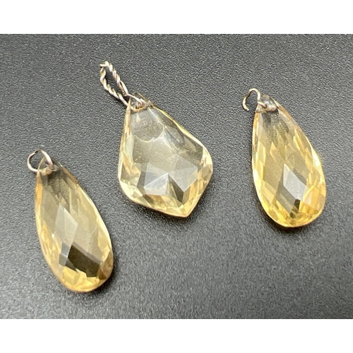 1087 - 3 faceted teardrop cut pale yellow citrine pendants with white metal bales. 2 in a classic oval tear... 