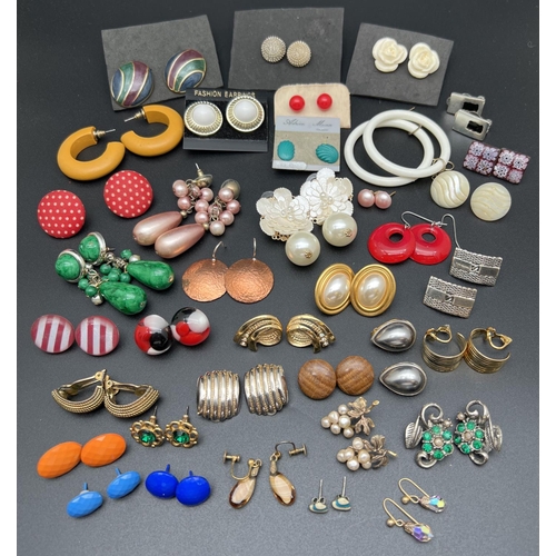 1089 - 24 pairs of vintage costume jewellery earrings. To include stud, drop and hooped styles. Both pierce... 