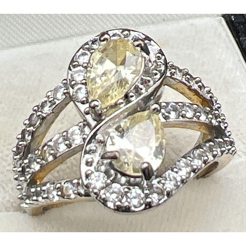 1092 - A 14ct gold plated cocktail ring set with Swarovski crystals. 2 teardrop cut pale lemon crystals set... 