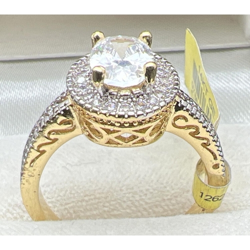 1093 - A 14ct gold plated Halo setting cocktail ring set with Swarovski crystals (brand new with tags). Cen... 