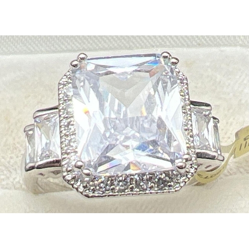 1095 - A rhodium plated cocktail ring set with clear Swarovski crystals, new with tags. A large square cut ... 