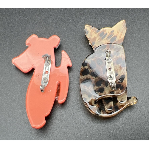 1099 - 2 Lea Stein style Lucite animal brooches. An orange and pale blue coloured dog together with an anim... 