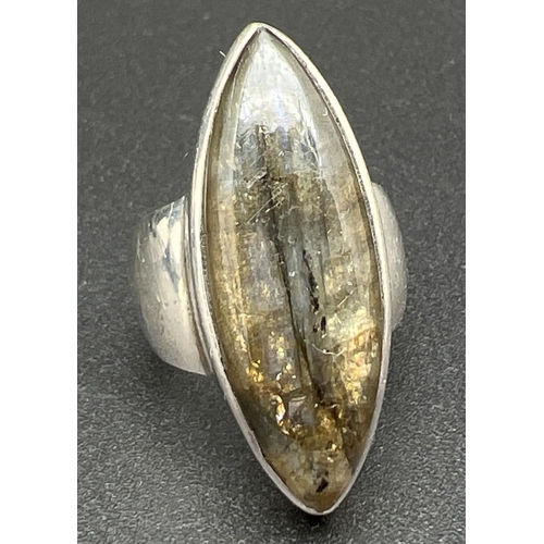 1106 - A large silver modern design dress ring set with a marquise cut piece of Labradorite. Silver mark in... 