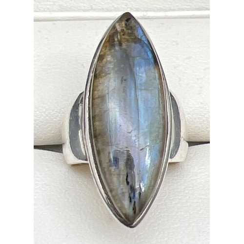 1106 - A large silver modern design dress ring set with a marquise cut piece of Labradorite. Silver mark in... 